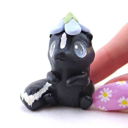 Skunk with a Bluebell Hat Figurine - Polymer Clay Spring Animal Collection