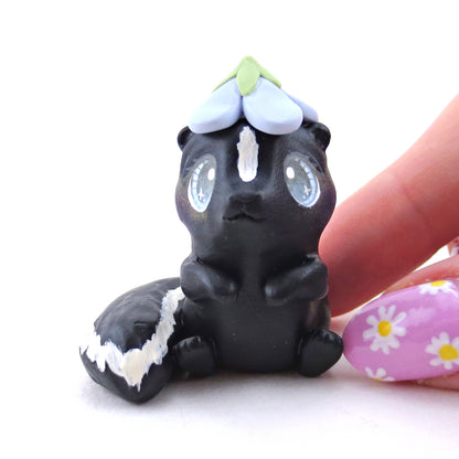 Skunk with a Bluebell Hat Figurine - Polymer Clay Spring Animal Collection